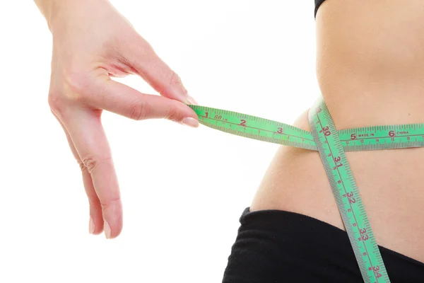 Weight loss. Green measuring tape on woman body — Stock Photo, Image