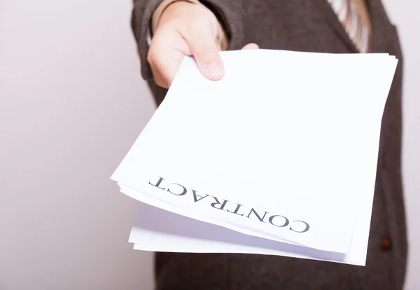 Businessman giving blank paper with sign contract — Stock Photo, Image