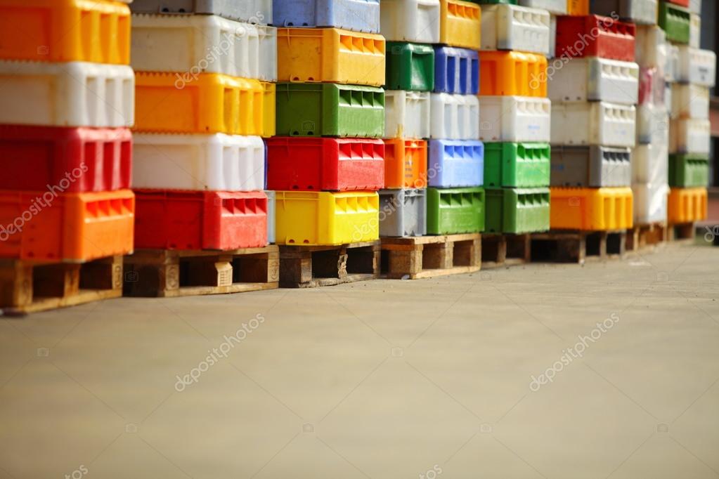 Colorful boxes plastic crates containers for fish Stock Photo by