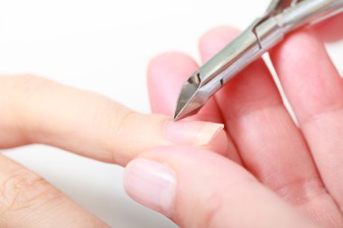 Beautician trimming cuticles female client. Manicure spa beauty salon clipart