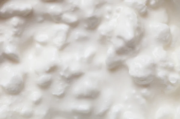 Textura de fundo close-up cottage cheese. Dieta e nutrição saudável . — Fotografia de Stock
