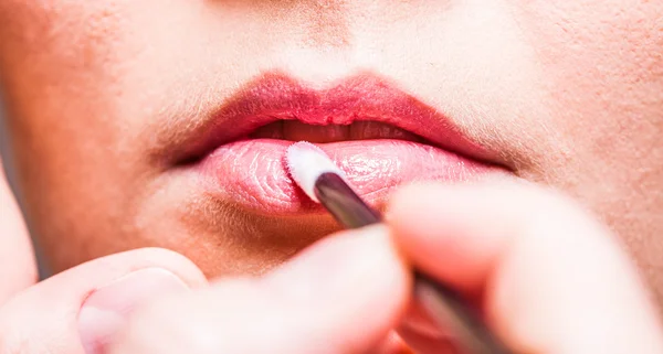 Makeup. Girl applying lipgloss lipstick on lips. Part of face. — Stock Photo, Image
