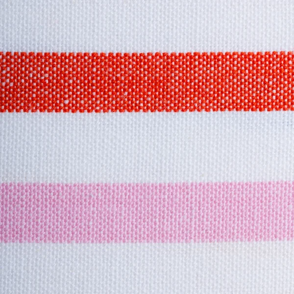 Primer plano de colorido rojo rosa blanco rayas textiles como fondo o textura — Foto de Stock