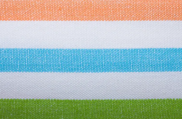 Primer plano del textil a rayas de colores como fondo o textura — Foto de Stock