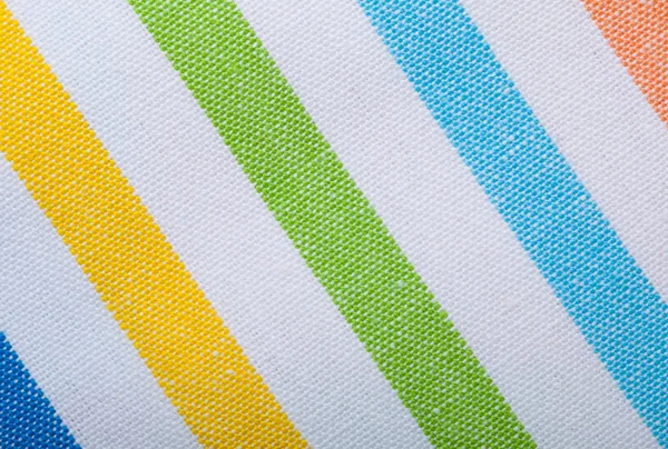 Primer plano del textil a rayas de colores como fondo o textura —  Fotos de Stock