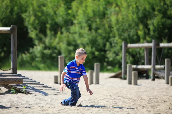 Child in playground, kid in action playing — Stok fotoğraf