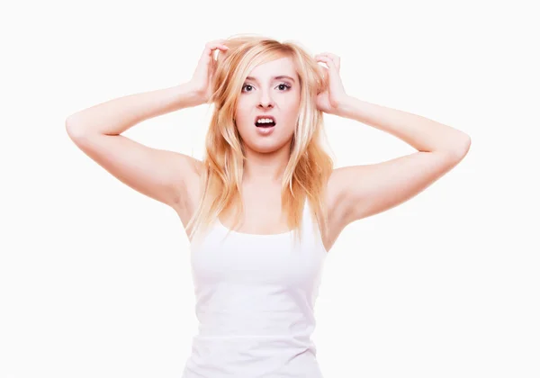 Stress. Young woman frustrated pulling her hair on white Royalty Free Stock Photos
