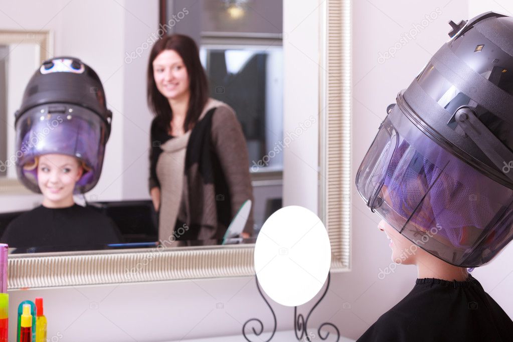 Girl Relaxing With Hairdryer By Hairstylist In Hair Beauty Salon
