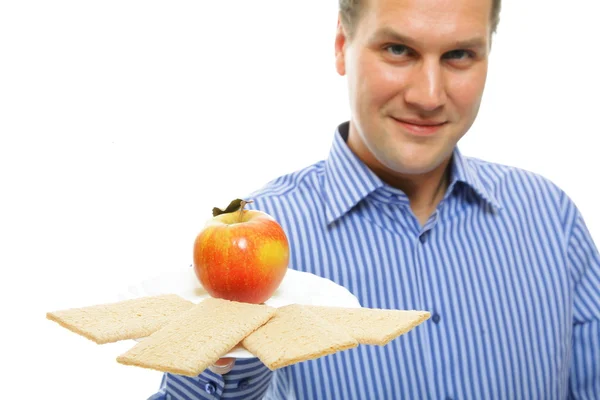 Healthy lifestyle man eating crispbread and apple — Stock Photo, Image