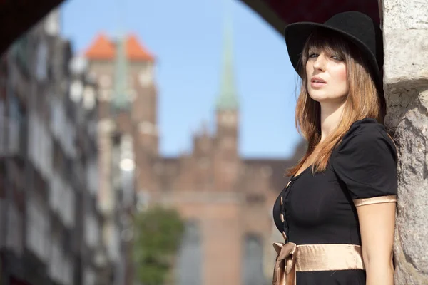 Retro woman in european city old town Gdansk — Stock Photo, Image