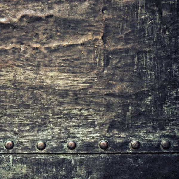 Grunge black metal plate with rivets screws background texture — Stock Photo, Image