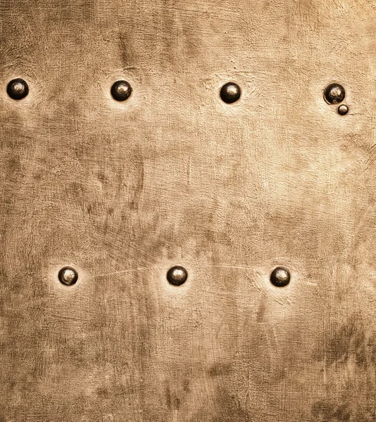 Grunge gold brown metal plate rivets screws background texture — Stock Photo, Image