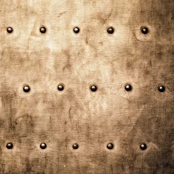 Grunge gold brown metal plate rivets screws background texture — Stock Photo, Image