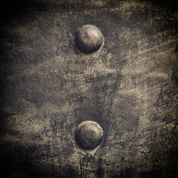 Grunge black metal plate with rivets screws background texture — Stock Photo, Image