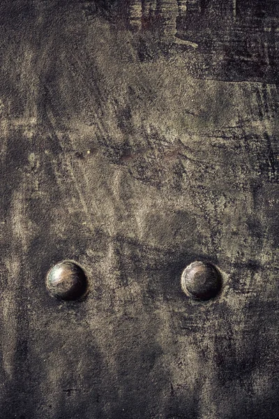 Grunge black metal plate with rivets screws background texture — Stock Photo, Image