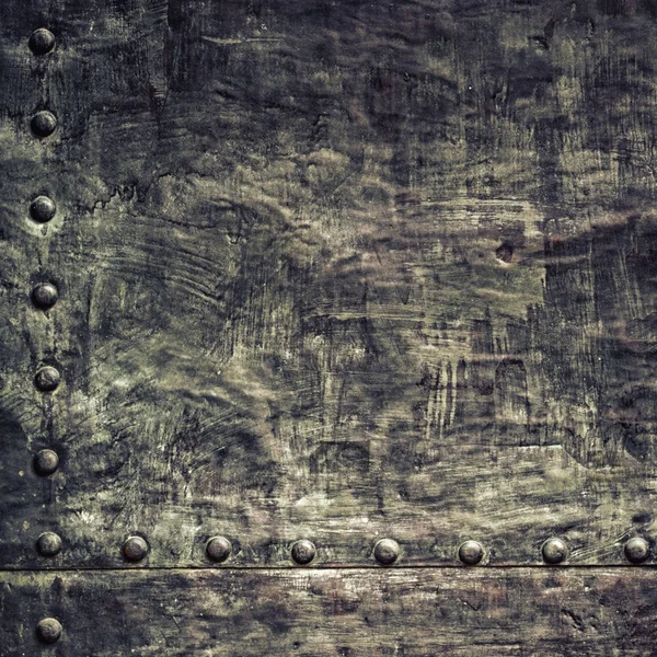 Grunge black metal plate with rivets screws background texture — Stock Photo, Image