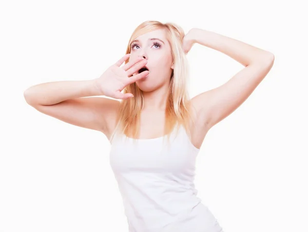 Sleepy tired young woman yawning isolated on white — Stock Photo, Image