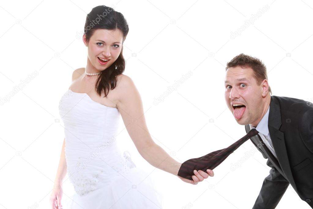 Woman pulling on mans tie, funny couple Stock Photo by ©Voyagerix 37687591