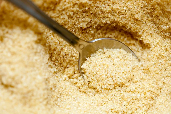 Close up brown sugar with spoon — Stock Photo, Image