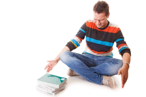 Müder College-Student mit Stapel Bücher für Prüfungen isoliert — Stockfoto