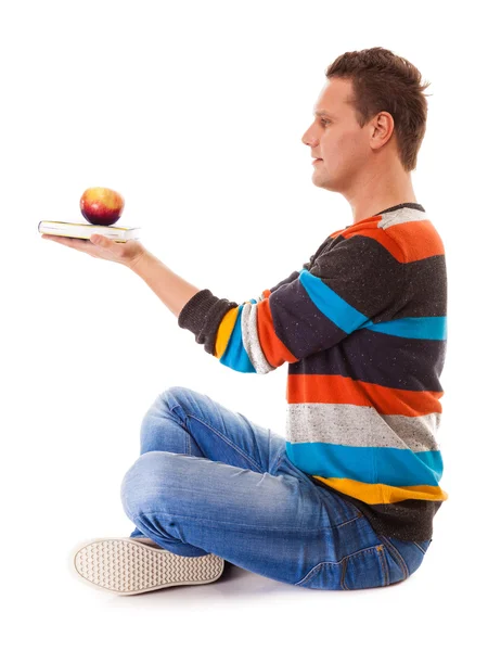 Man holding book and red apple. Healthy mind and body — Stock Photo, Image