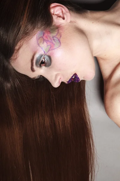 Woman with long hair and makeup — Stock Photo, Image