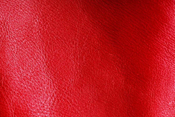 Texture of folds vivid red skin leather background — Stock Photo, Image