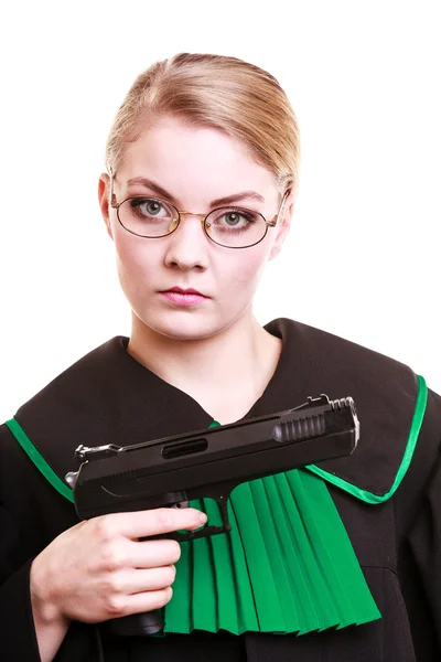 Woman lawyer attorney in polish black green gown with gun — Stock Photo, Image