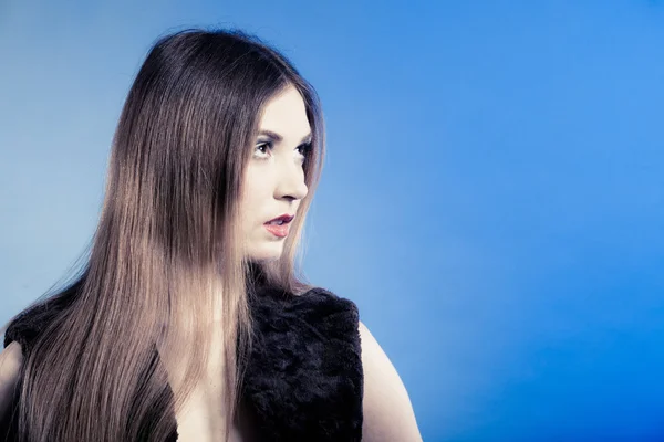 Fashionable girl with long hair. Young woman in fur waistcoat. — Stock Photo, Image