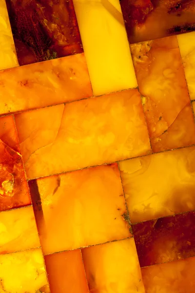 Closeup of golden amber mosaic as background or texture. Gem. — Stock Photo, Image