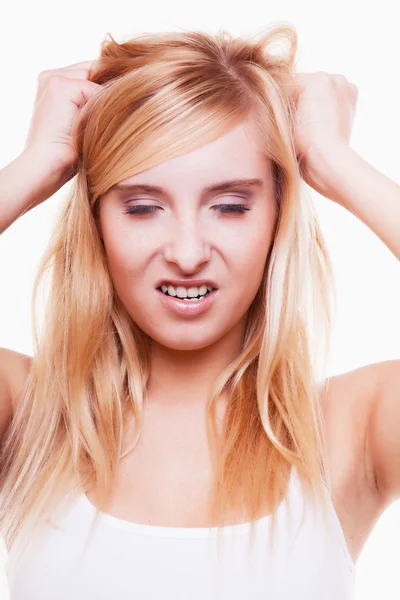 Stress. Young woman frustrated pulling her hair on white — Stock Photo, Image