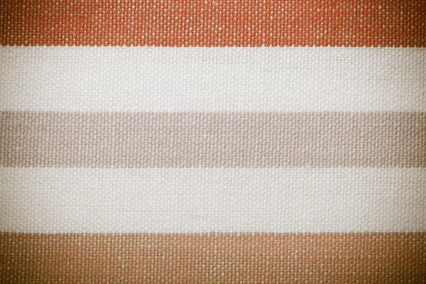 Close-up van kleurrijke grijs oranje wit gestreept textiel als achtergrond of textuur — Stockfoto