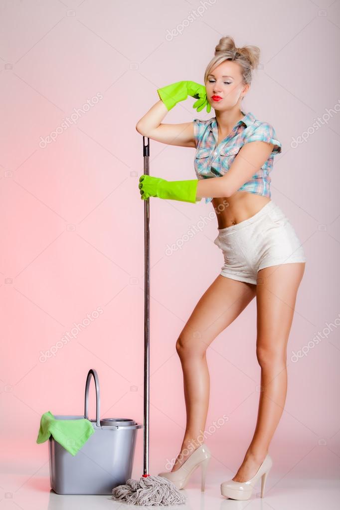 Sexy girl retro style, woman housewife cleaner with mop Stock Photo by  ©Voyagerix 39288217