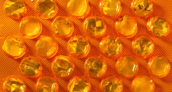Pomarańczowy pakiet tabletki tabletki leku medycyna jako tło — Zdjęcie stockowe