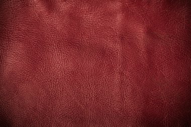 Red textured leather grunge background closeup clipart
