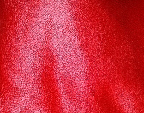ひだ鮮やかな赤色の皮膚革背景テクスチャ — ストック写真
