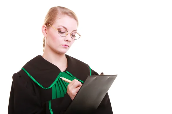 Woman lawyer attorney in classic polish gown writing on clipboard — Stock Photo, Image