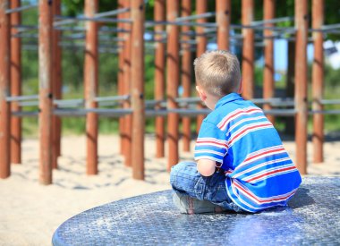 thoughtful child boy or kid on playground clipart