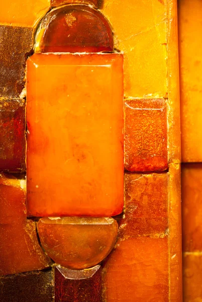 Närbild av gyllene amber mosaik som bakgrund eller konsistens. pärla. — Stockfoto