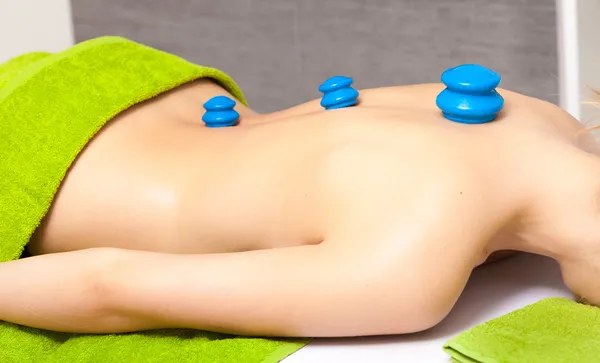 Beauty salon. Woman getting spa cupping glass vacuum massage