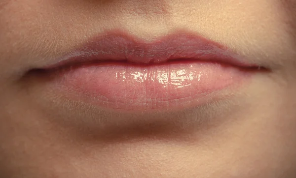 Closeup shiny female lips. Part of face. Makeup and beauty. — Stock Photo, Image