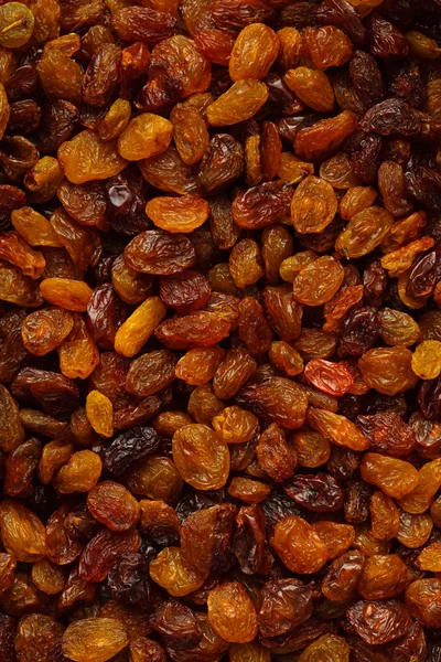 Alimento saludable para la dieta. Pasas de uva seca como textura de fondo —  Fotos de Stock