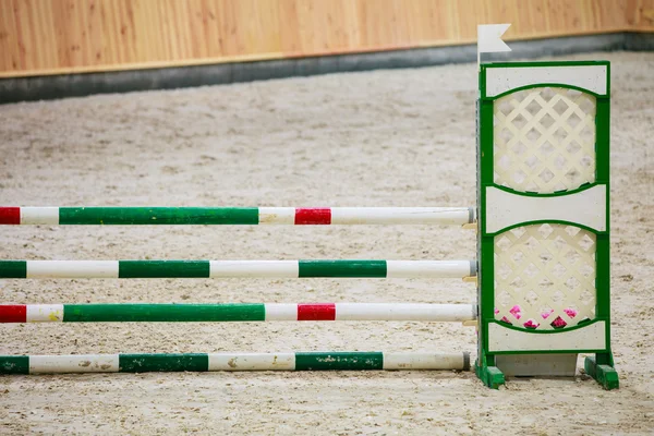 Green red white obstacle for jumping horses. Riding competition. — Stock Photo, Image