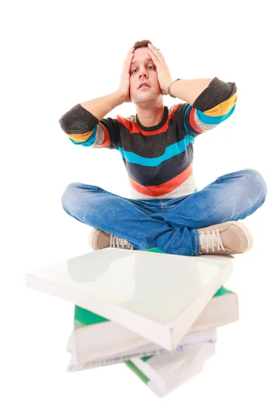 Exhausted tired college student with pile of books studying for exam — Stock Photo, Image