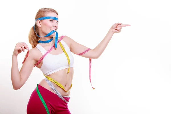 Sporty fit woman with measure tapes. Time for diet slimming. — Stock Photo, Image
