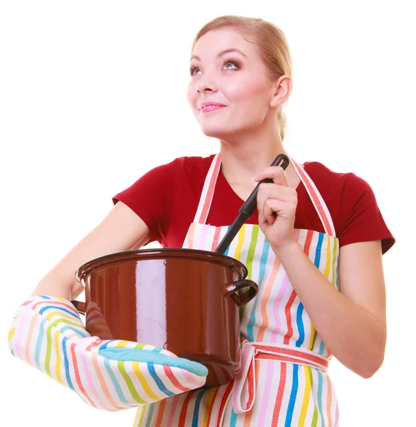 Happy housewife or chef in kitchen apron with pot of soup ladle — Stock Photo, Image