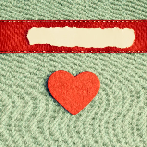 Valentines day background. paper blank heart on green fabric material Stock Photo
