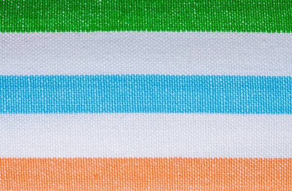 Close-up van kleurrijk gestreept textiel als achtergrond of textuur — Stockfoto
