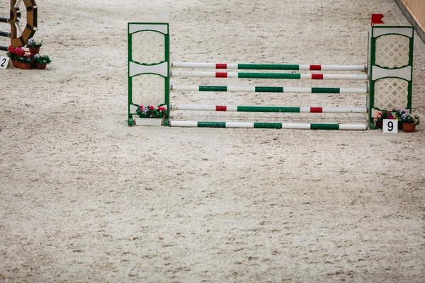 Green red white obstacle for jumping horses. Riding competition. — Stock Photo, Image