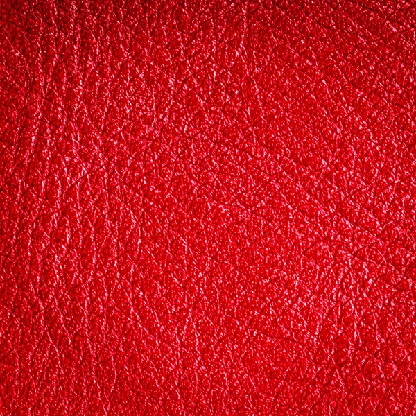 Red textured leather grunge background closeup — Stock Photo, Image